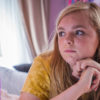 Elsie Fisher with her head on her hands looking longingly at a computer screen in Bo Burnham's Eighth Grade, the opening night film at IFFBoston 2018.
